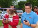 ARRL Teachers Institute Instructor Nathan McCray, K9CPO (right), helps a TI participant complete a QSO with satellite AO27 during the TI session in Michigan.