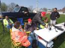 Jim Pitchford, N9LQF, Macoupin County Emergency Coordinator, showing Dawn Knotts, KC9MWN, how to operate net control from Station 3, midway through the hike. Also in the photo are Skip Riba, WS9V (left, yellow jacket); Carol Jones, KC9NIX; Charlie Ritter, KB9OXH, and Craig Held, KC9JFM (standing at right).